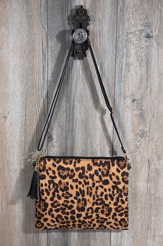 Animal print wristlet with tassel cross body/clutch bag